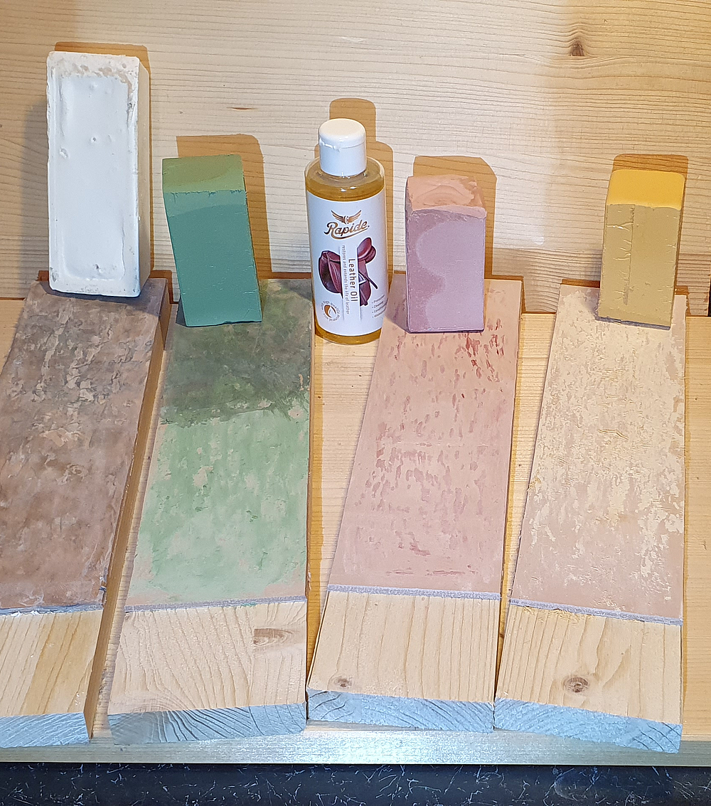 My homemade stropping leathers in various stages of completion (buffing wax)